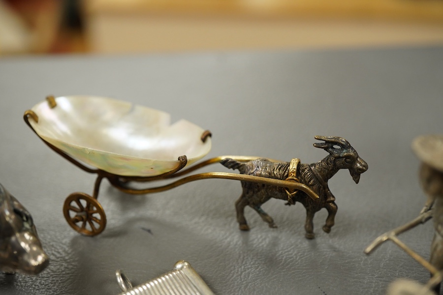 Sundry small silver and other items including a pig pin cushion, Adie & Lovekin, Birmingham, 1906, 45mm, a silver circular stamp case, a silver vesta case, a small sterling mounted notecase, three small metal rickshaws,